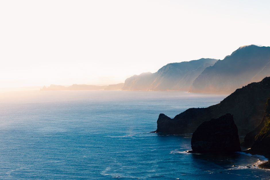 Experience the serene coastline of Santana, Madeira at sunset with stunning cliffs and ocean views.