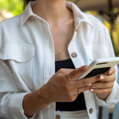 Hands holding a phone, by archisude on Pexels