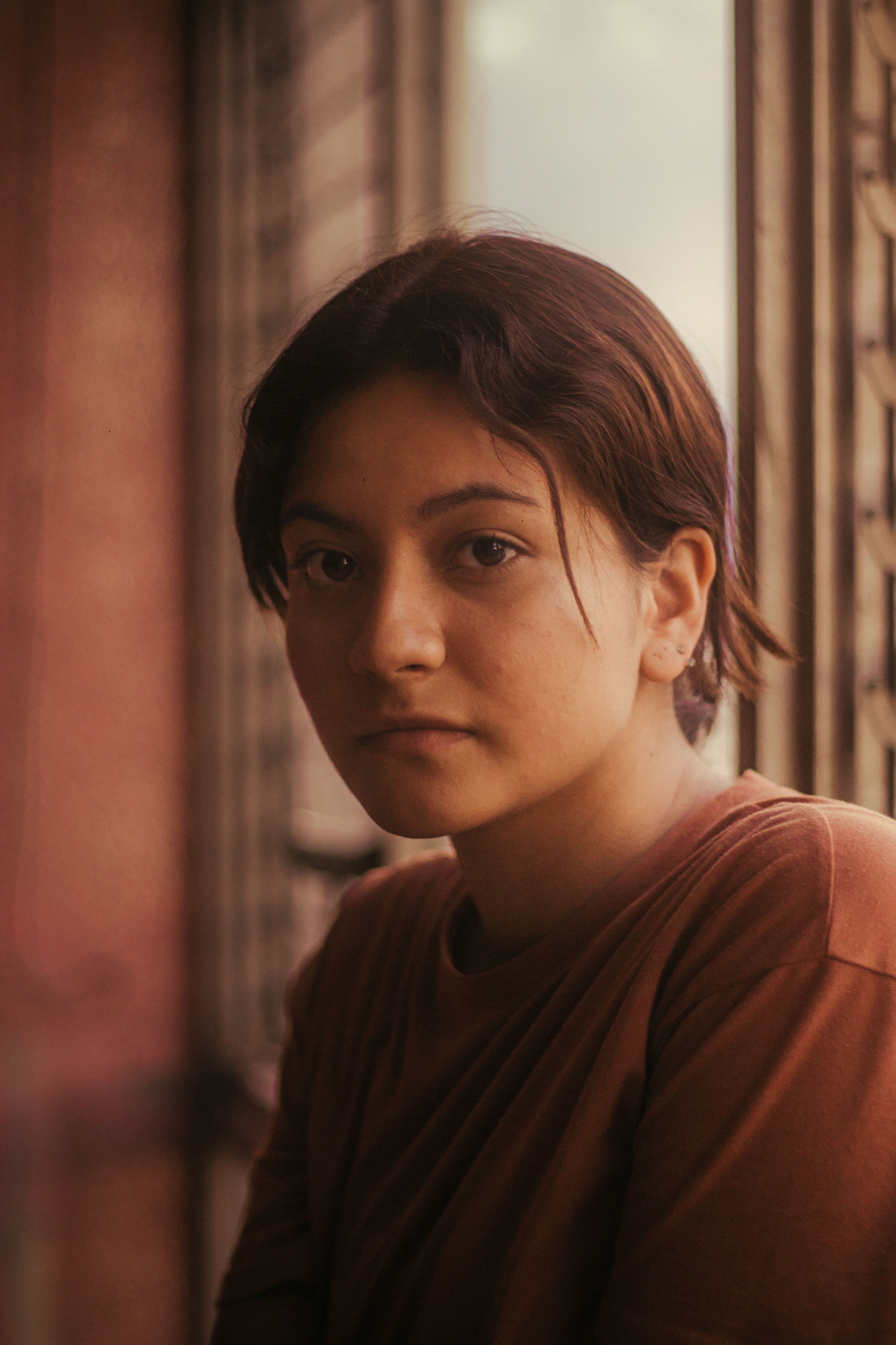 Candid portrait in soft natural light, relaxed and composed