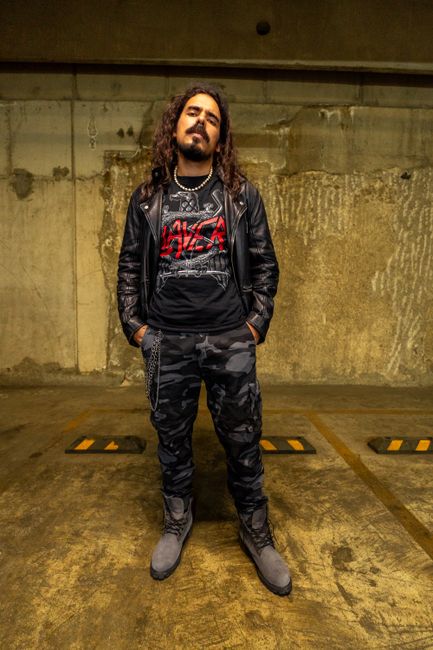 Portrait of a man in grunge fashion standing in an urban setting, Mexico City.