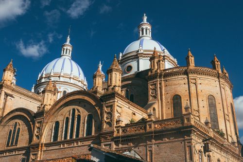 Free A stunning cathedral featuring exquisite blue domes under a clear blue sky, showcasing architectural brilliance. Stock Photo