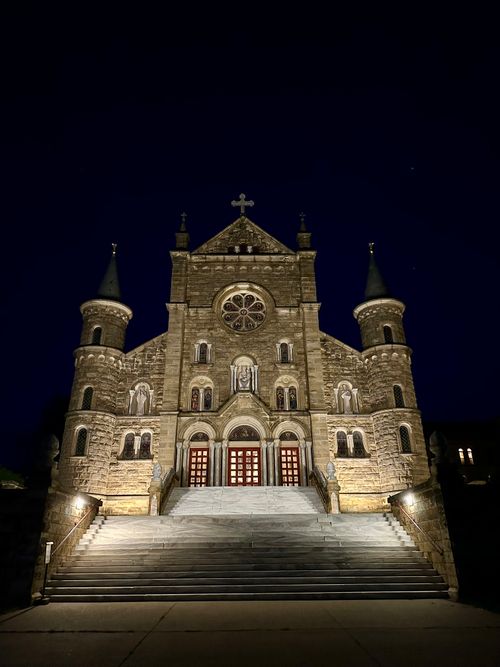 Free Dramatic night photograph of Saint Meinrad Archabbey in Indiana, showcasing Gothic architecture. Stock Photo