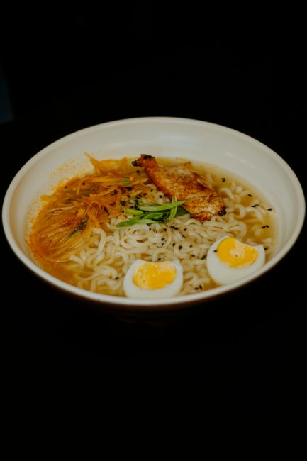 korean chicken dish with vegetables and cheese