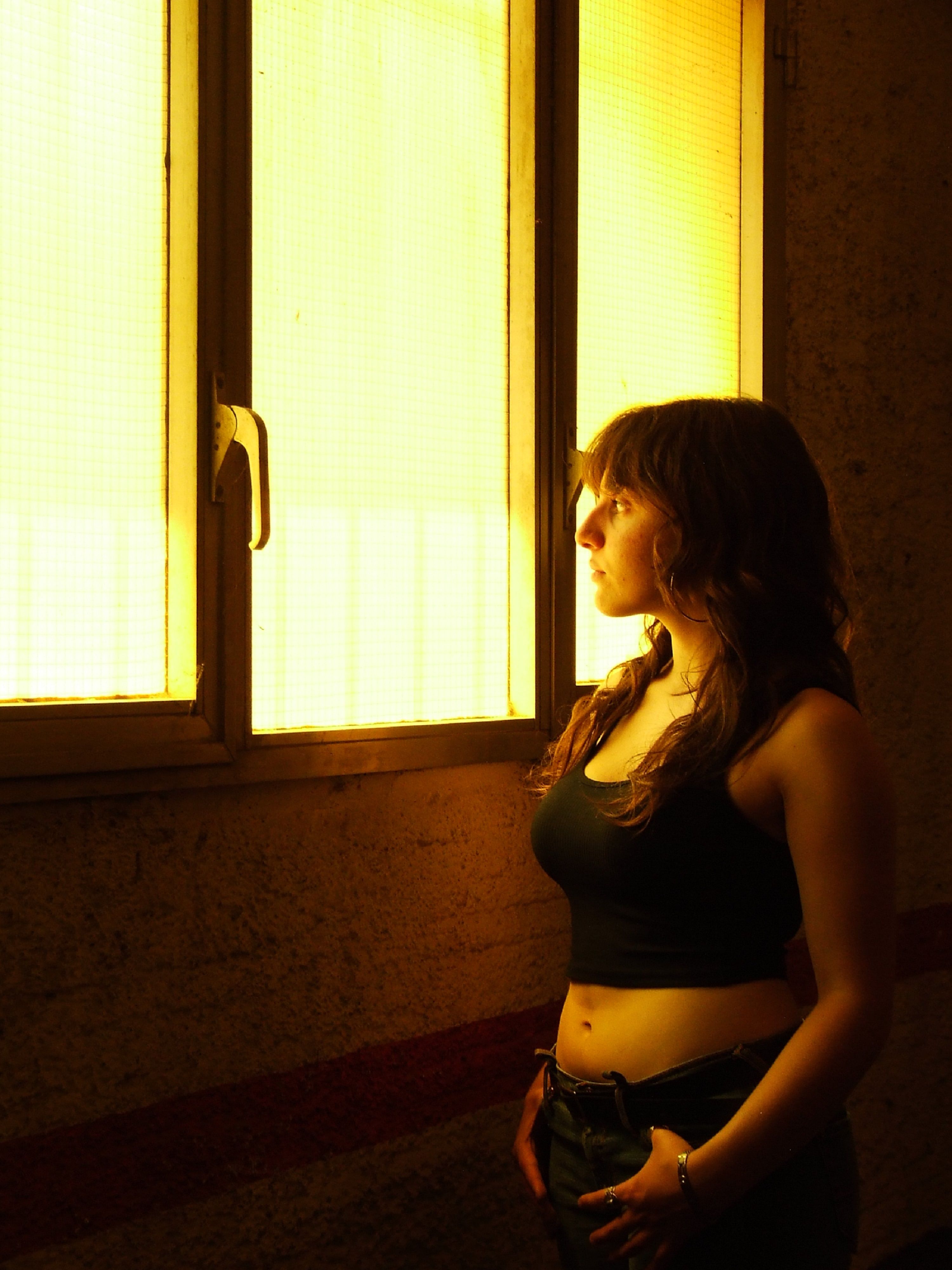 Woman in Front of a Window in Shadow · Free Stock Photo
