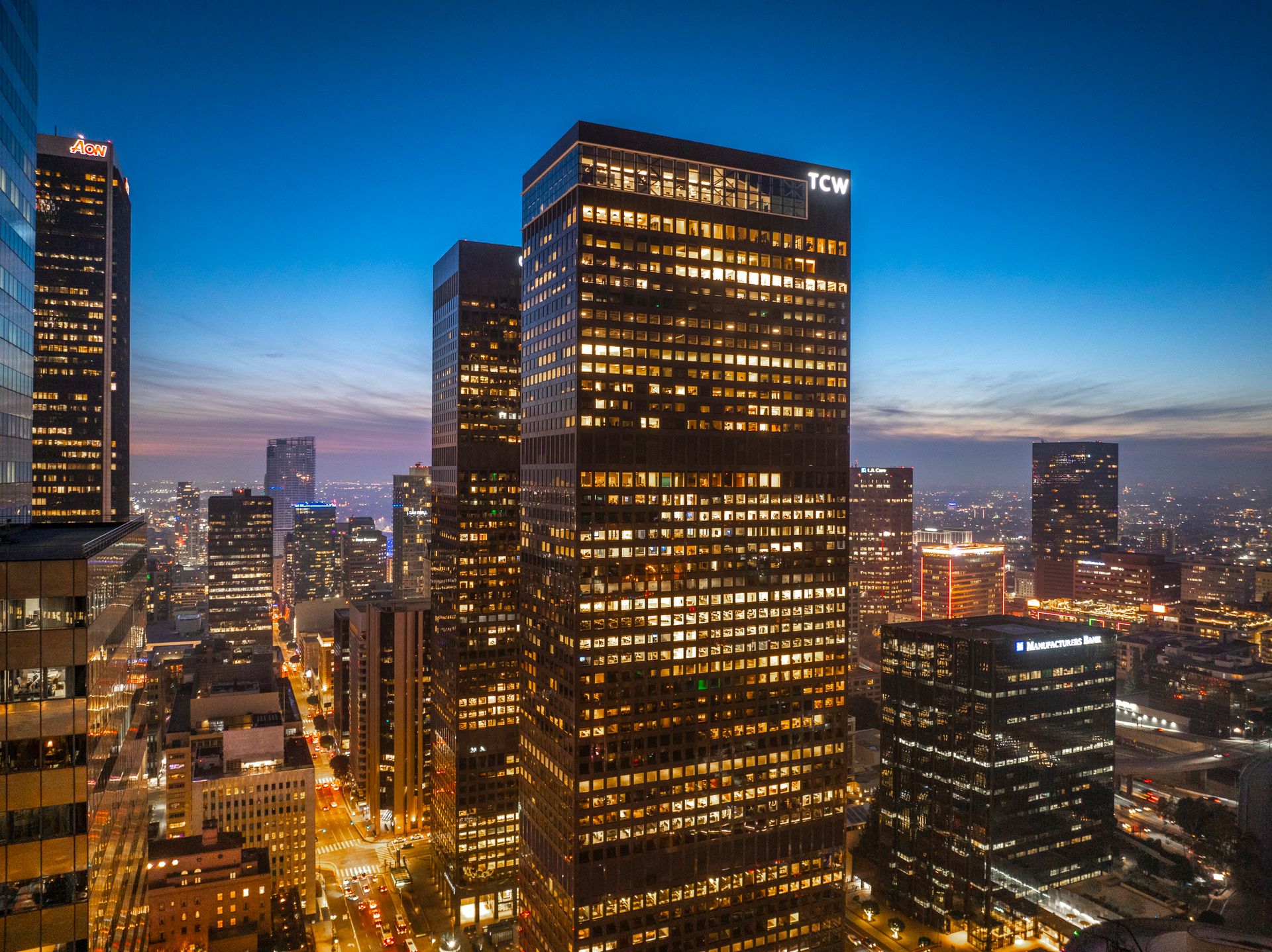 A breathtaking view of Los Angeles' cityscape at dusk with dazzling lights and modern skyscrapers.