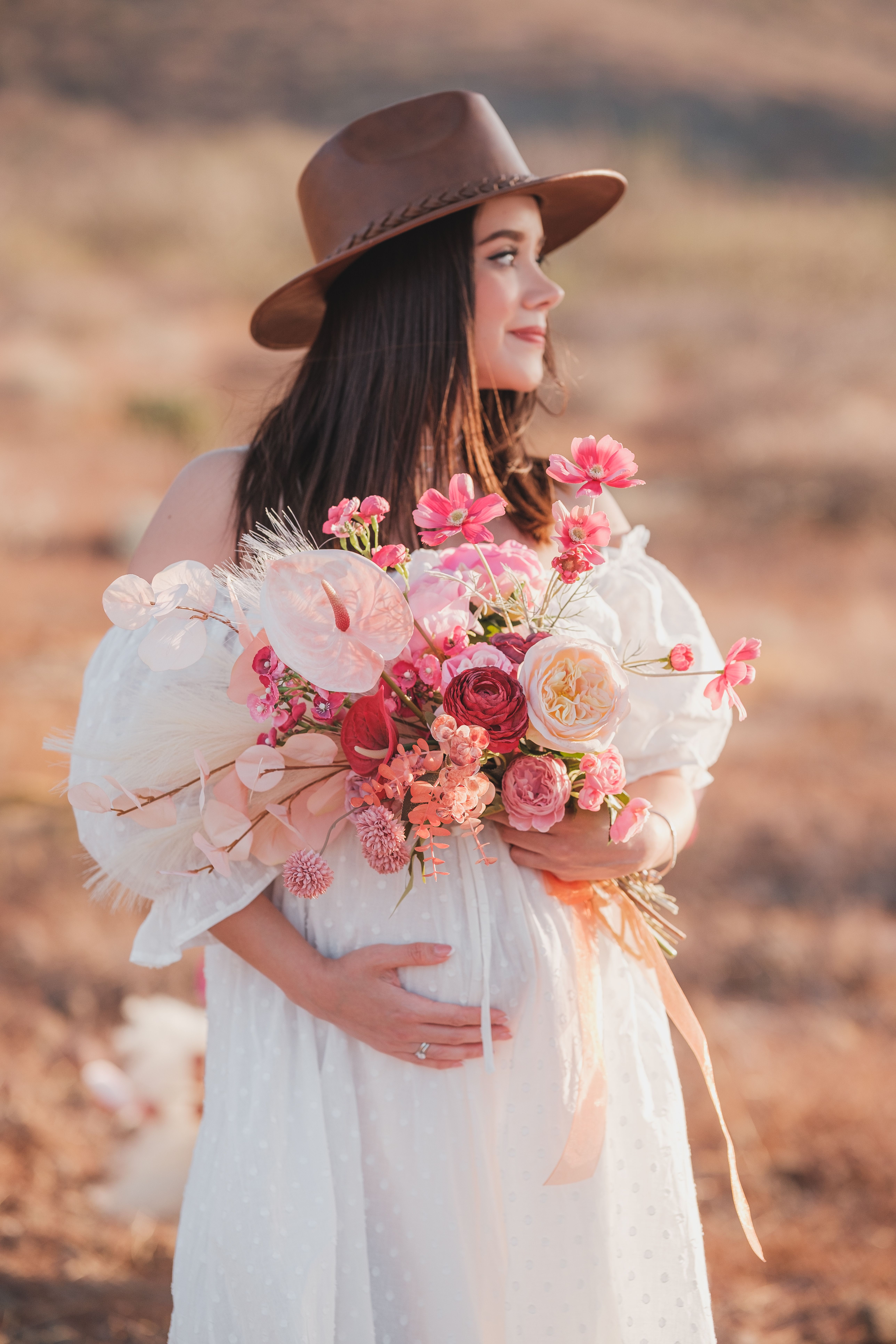 Woman in Pink Hat Holding Bouquet · Free Stock Photo