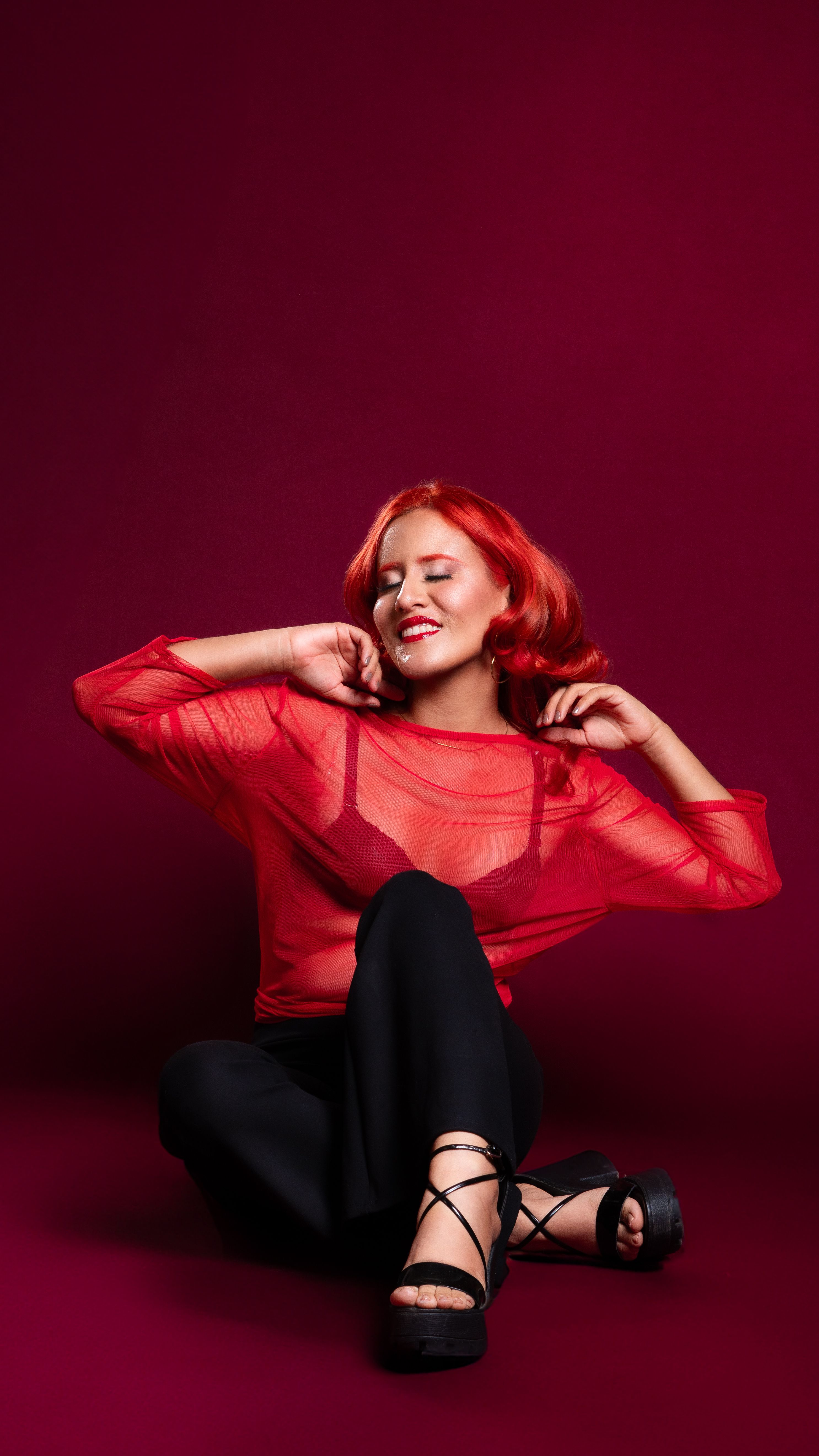 Woman With Red Hair Posing in a Studio · Free Stock Photo