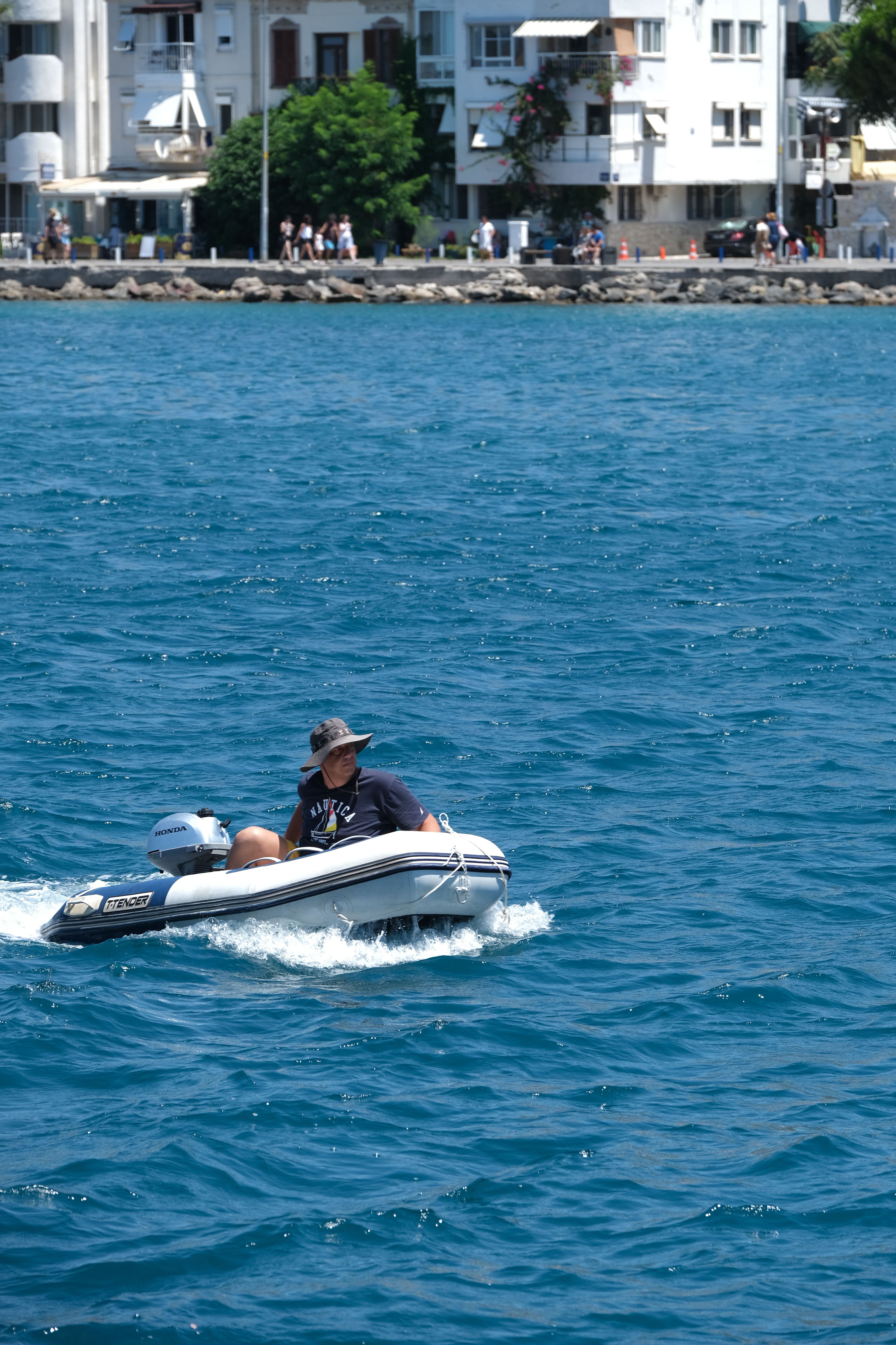 Man Riding Inflatable Boat in Blue Sea · Free Stock Photo