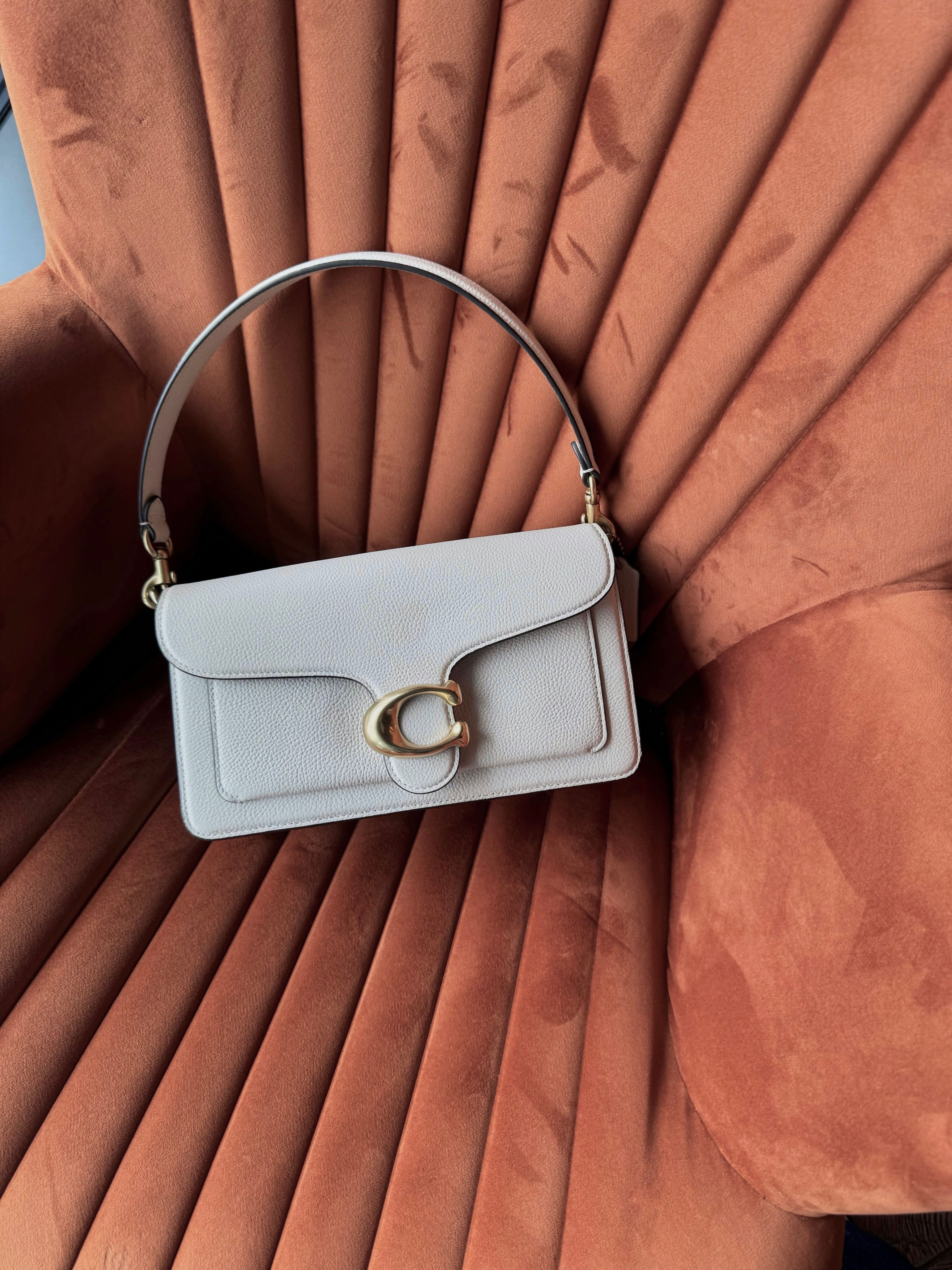 Signature leather and cashmere pieces on plaster and travertine blocks