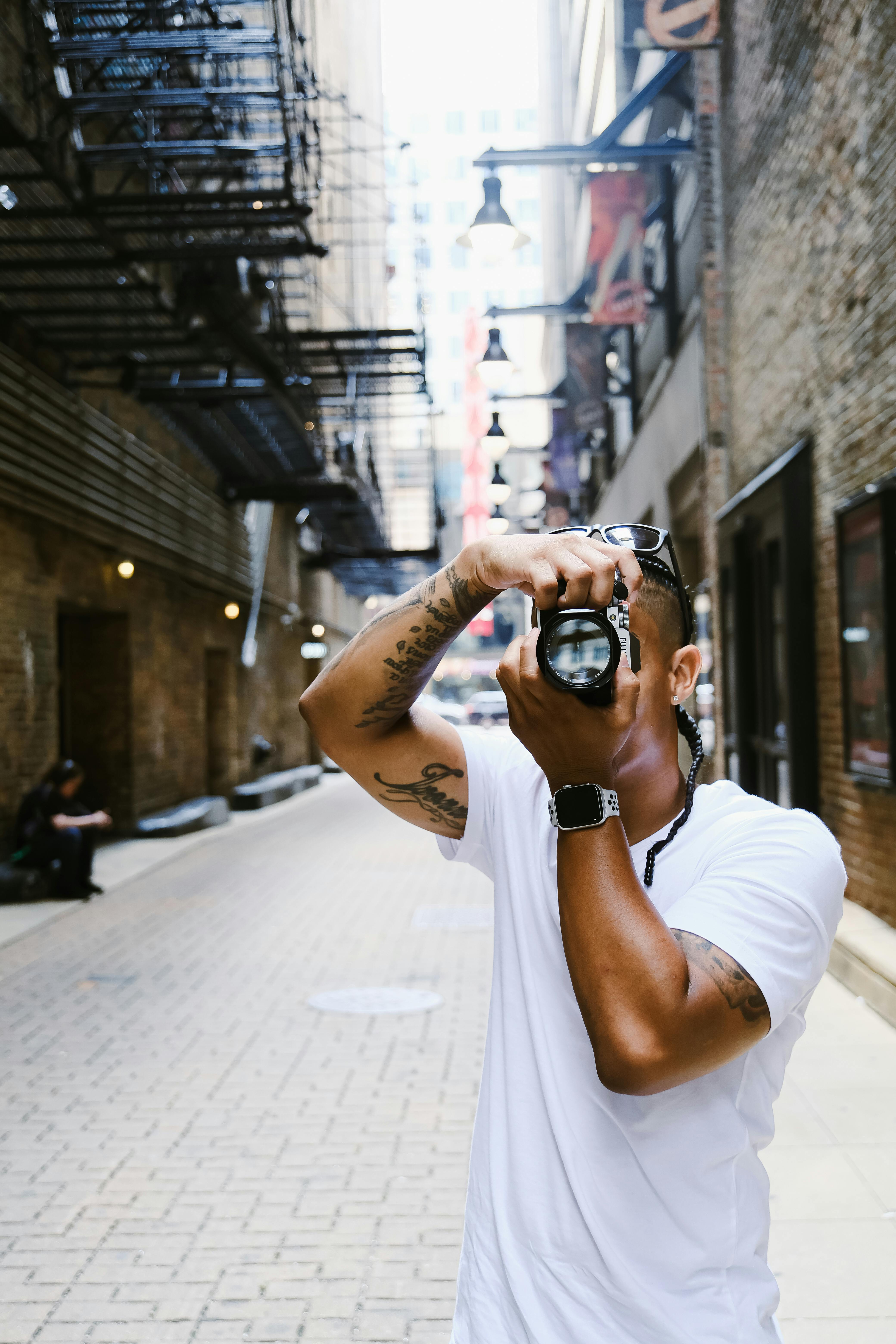 street photographer holding up camera