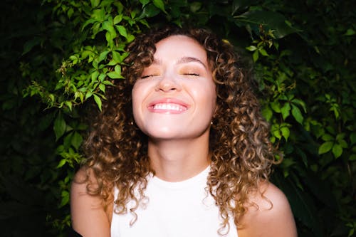 Free Smiling Woman With Curly Hair Stock Photo