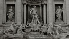 Grayscale Photo of Sculptures