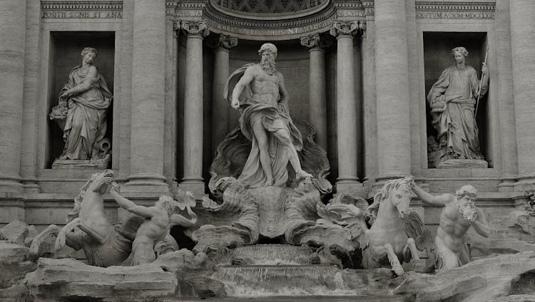 Grayscale Photo Of Sculptures