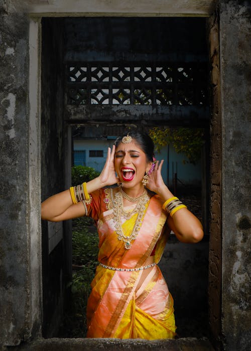 Free Woman in Yellow and Orange Sari Dress Stock Photo
