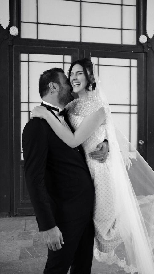 Free Laughing bride and groom in an intimate wedding moment, full of joy and elegance. Stock Photo