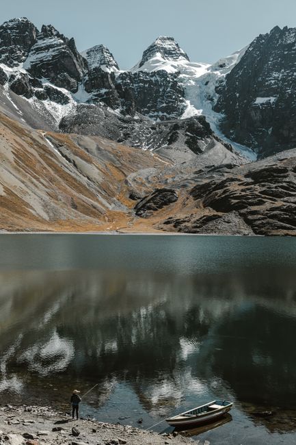 Reflective lake and towering mountains in Condoriri, Bolivia. Serene nature scene.