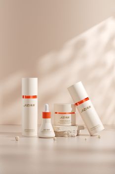 Minimalist presentation of skincare products on a neutral background, ideal for beauty and healthcare themes.