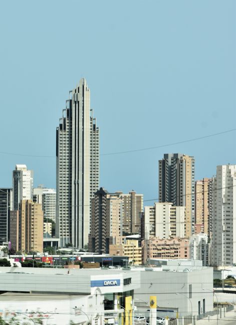 Beautiful urban cityscape featuring modern skyscrapers and a clear blue sky.
