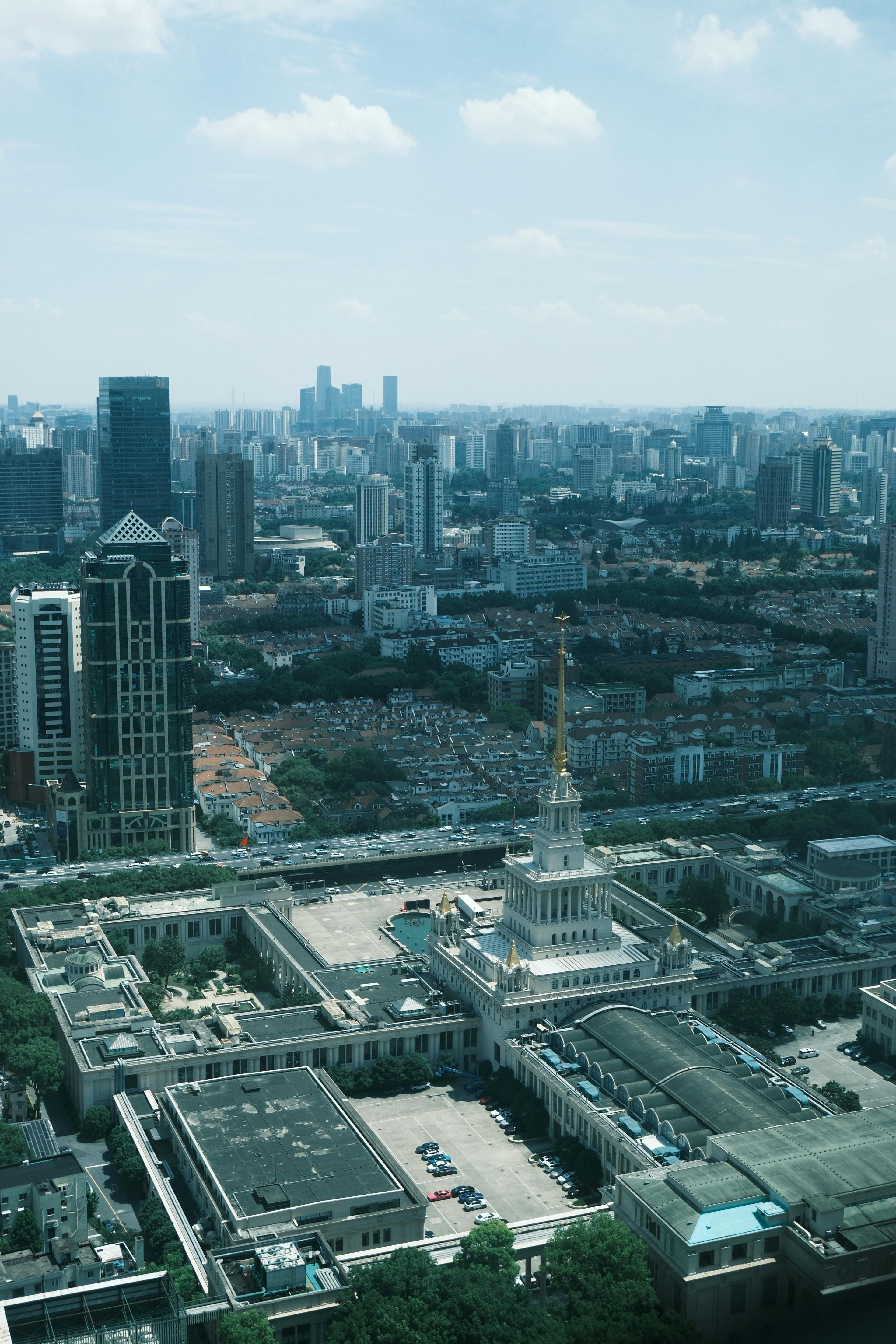 Captivating aerial view of a modern city skyline with a central historic landmark.