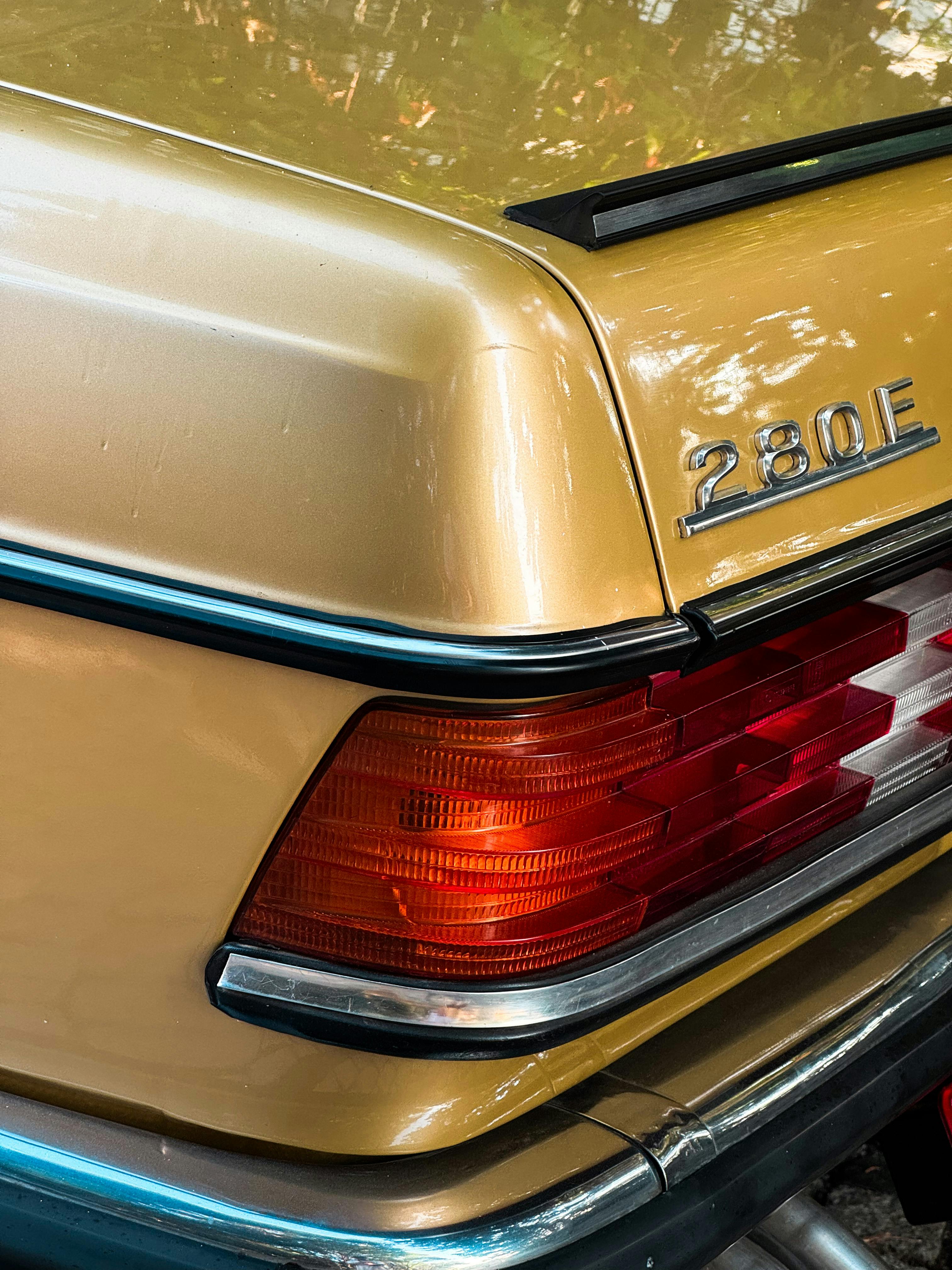 a close up of the tail light of a yellow car