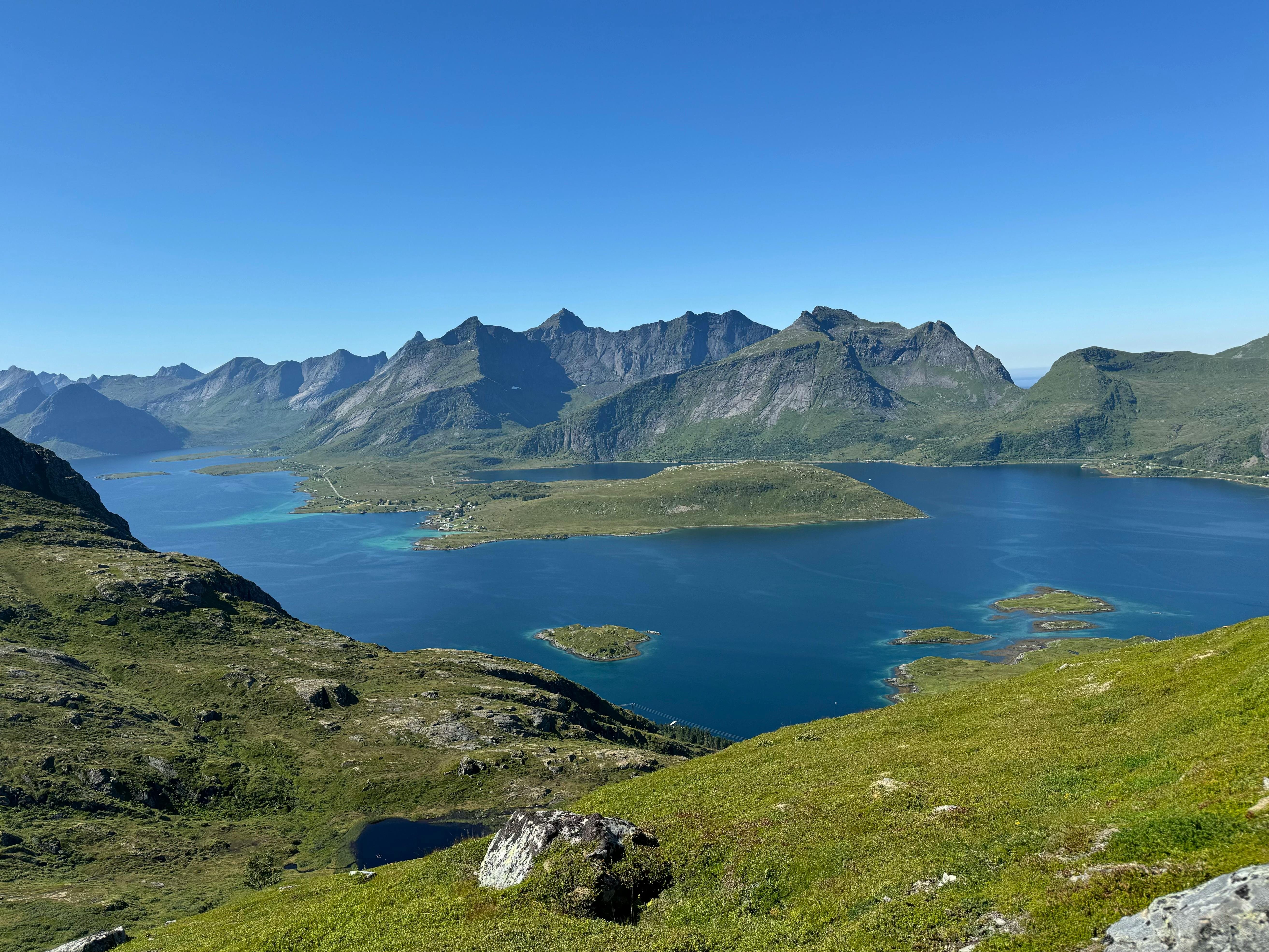 a view of a lake and mountains from a mountain