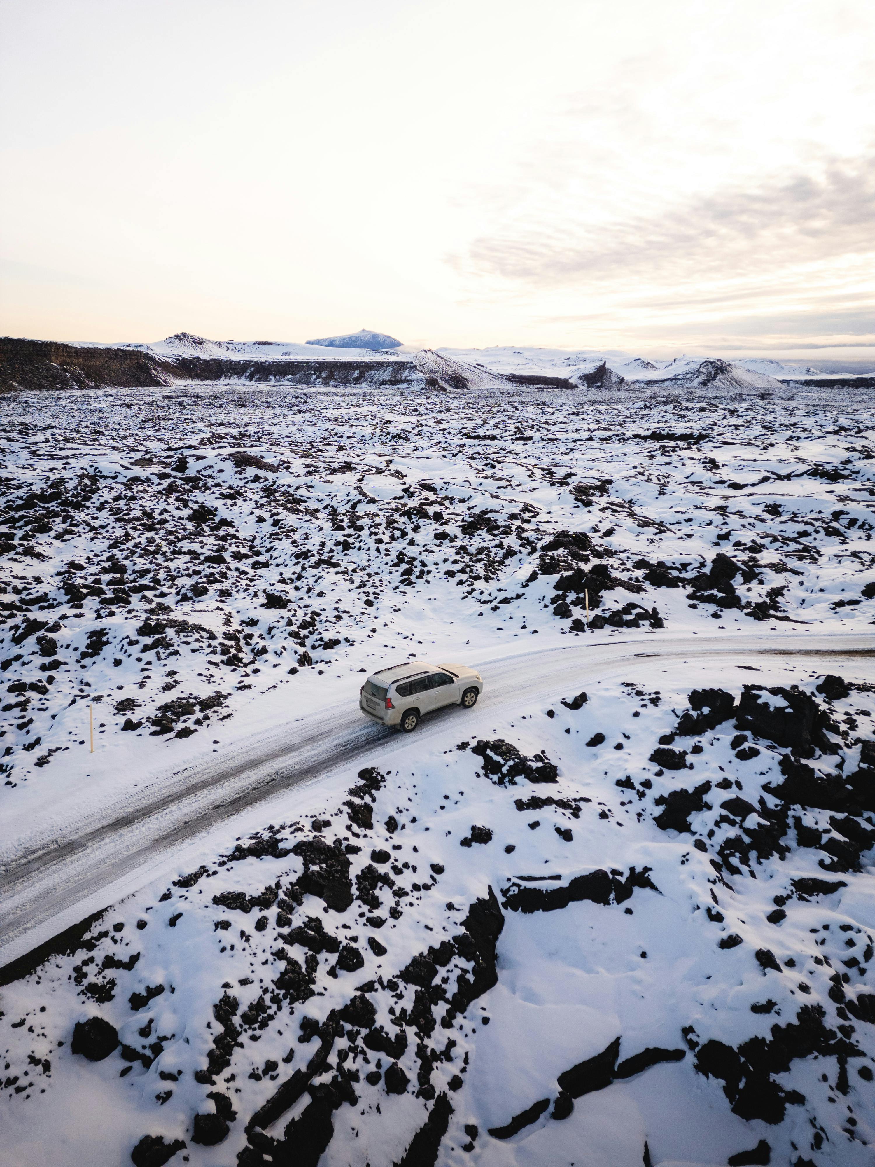 suv driving car in winter landscape