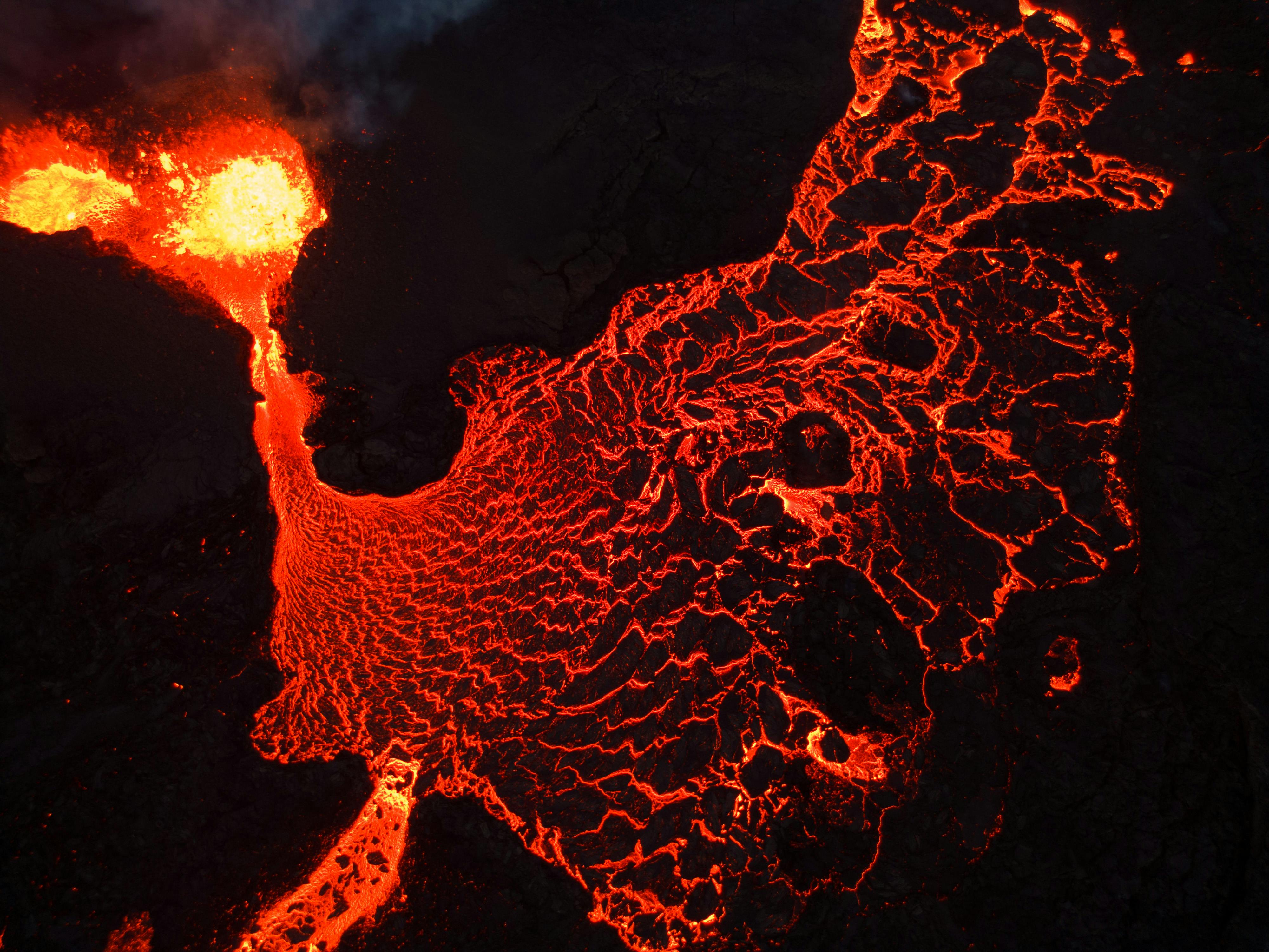 https://www.pexels.com/photo/lava-flowing-from-crater-at-night-27245744/