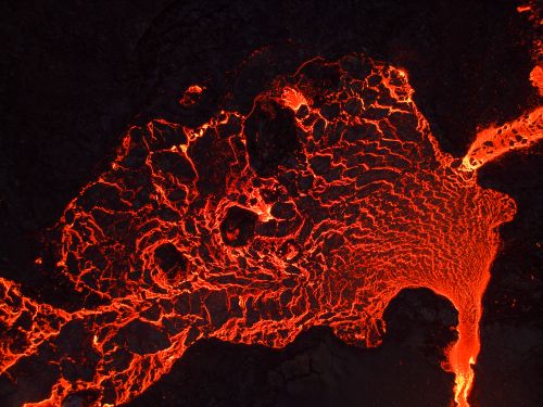 Free Dramatic aerial shot of glowing lava textures and patterns from a volcanic eruption in Iceland. Stock Photo