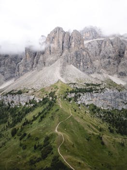 Stunning aerial view of the Dolomites in Selva di Val Gardena, Italy with lush greenery.