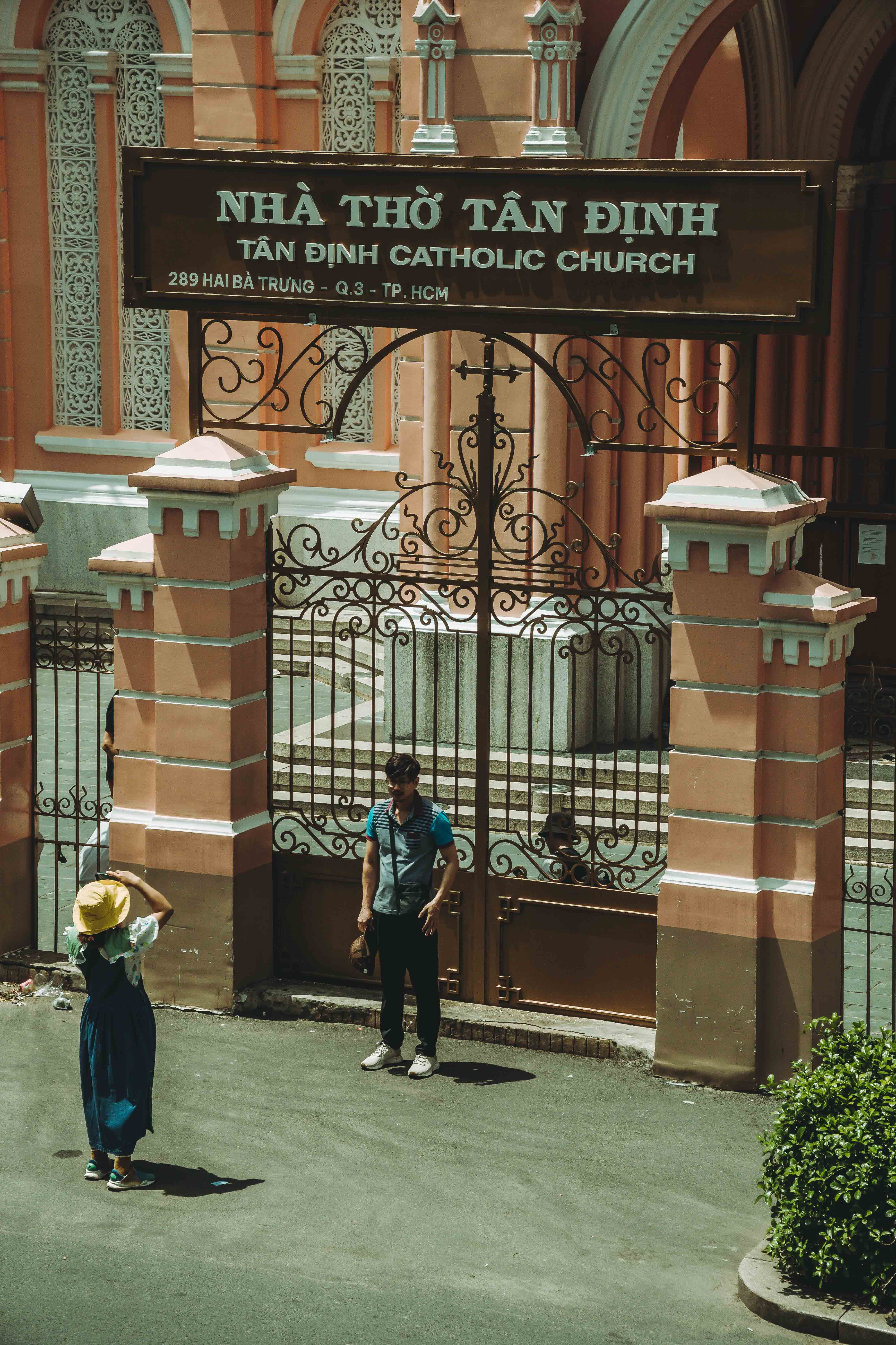 Visitors explore iconic Tân Định Catholic Church in vibrant Ho Chi Minh City.