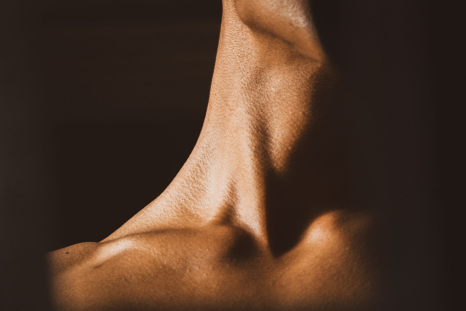 Person sitting upright during a neck and shoulder mobility appointment