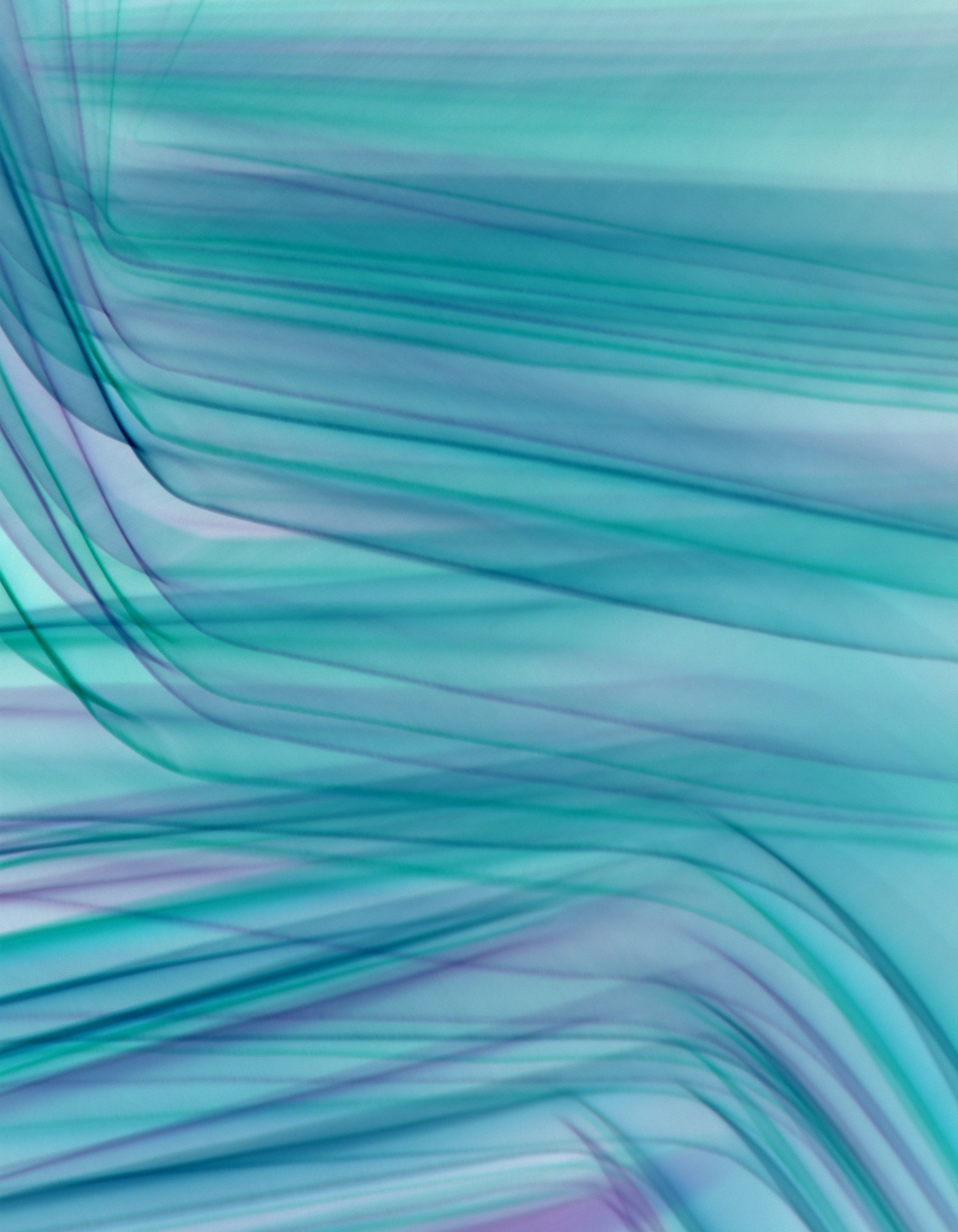 Vibrant abstract turquoise wave pattern with smooth textures and motion effects, perfect for backgrounds.