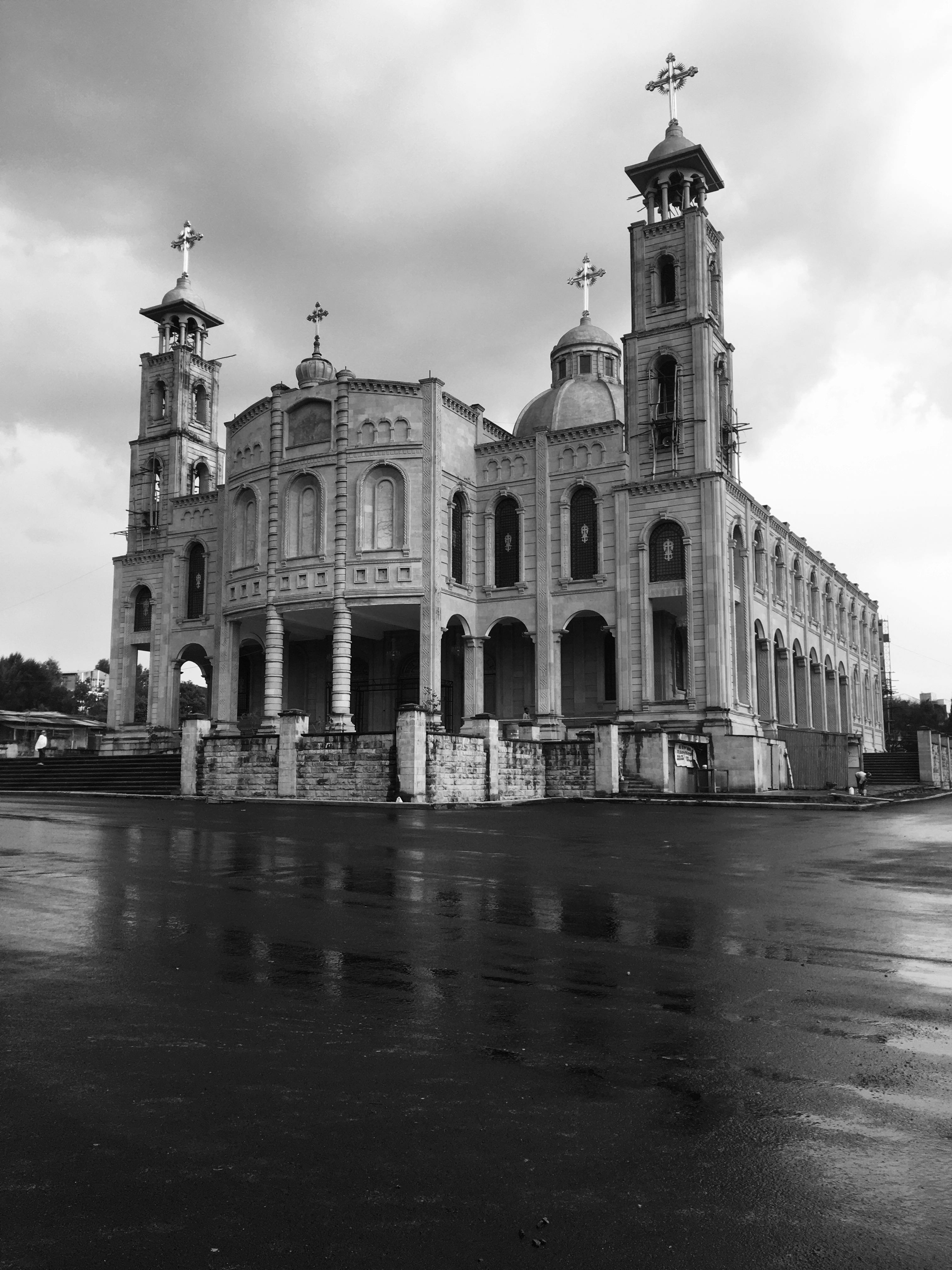 Elegant black and white photo of a historic cathedral in Addis Ababa, Ethiopia, showcasing its grand architecture.