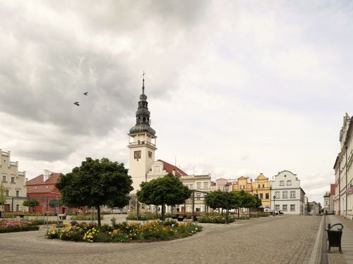 Free Charming town square in Bytom Odrzański, Poland, showcasing historic architecture under a cloudy sky. Stock Photo