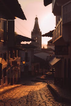 Gorgeous sunset view of historic street with church in Cuetzalan, Mexico.