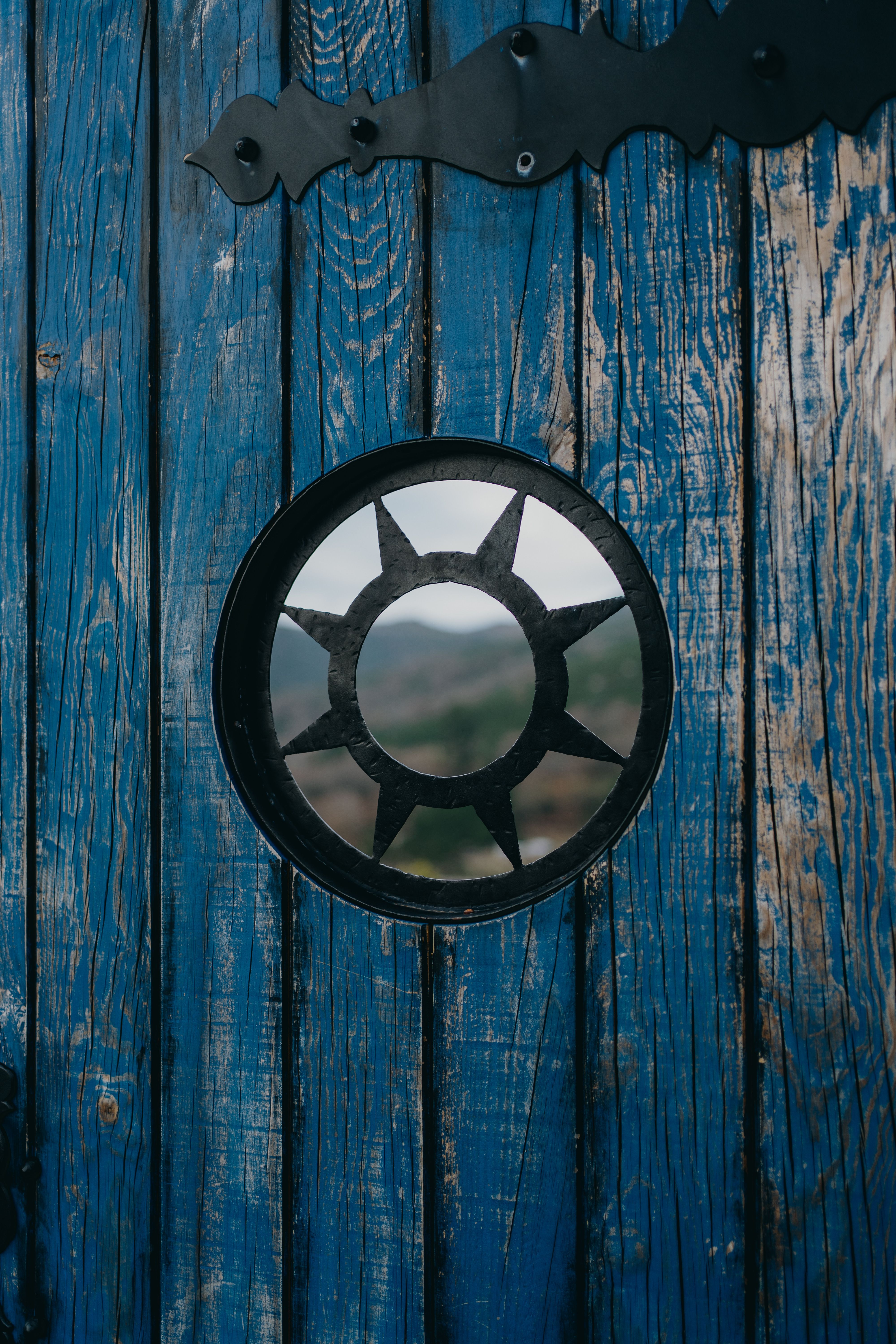 Round Window in Blue Wall · Free Stock Photo