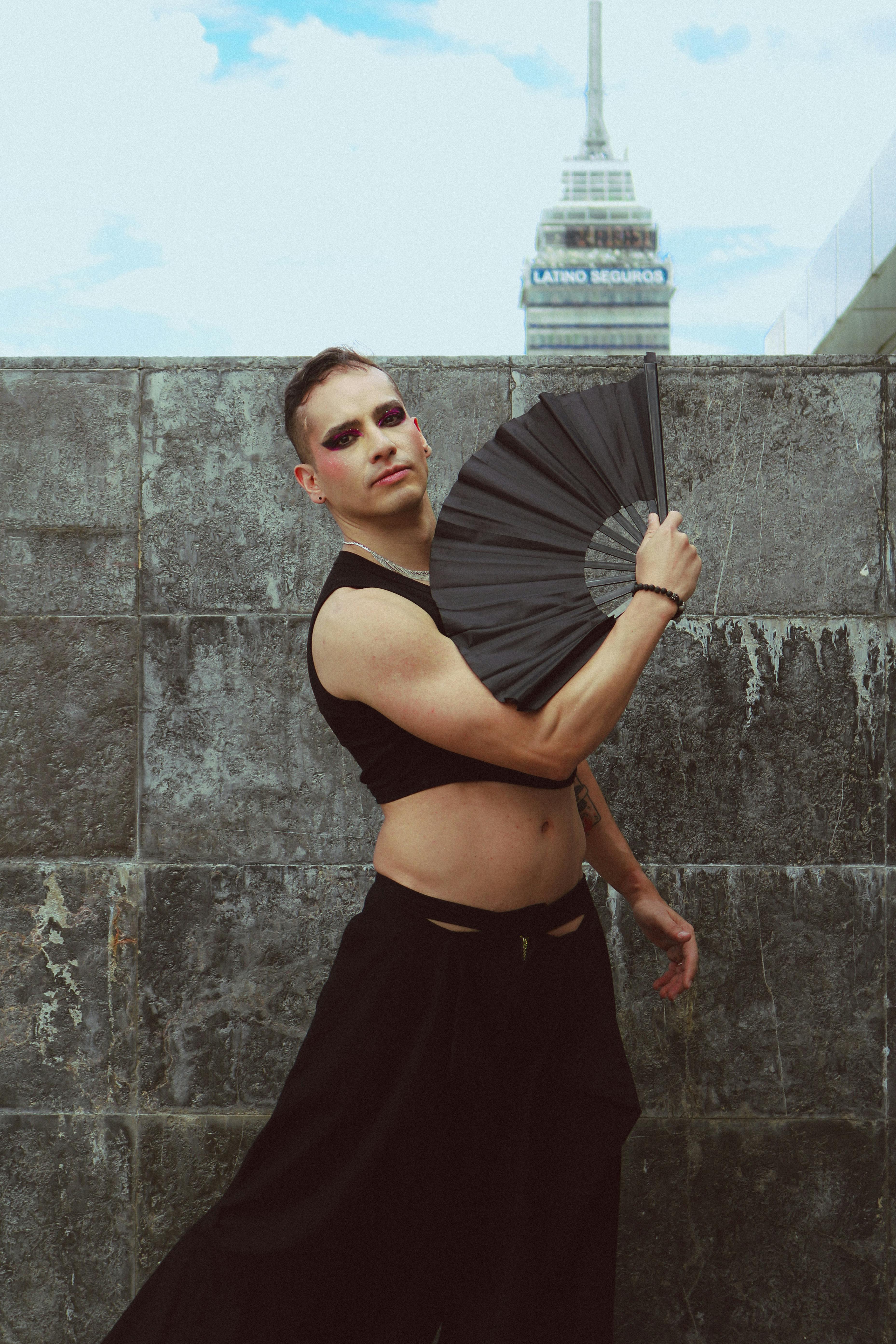 Captivating portrait of an adult expressing contemporary fashion with a backdrop of iconic architecture.