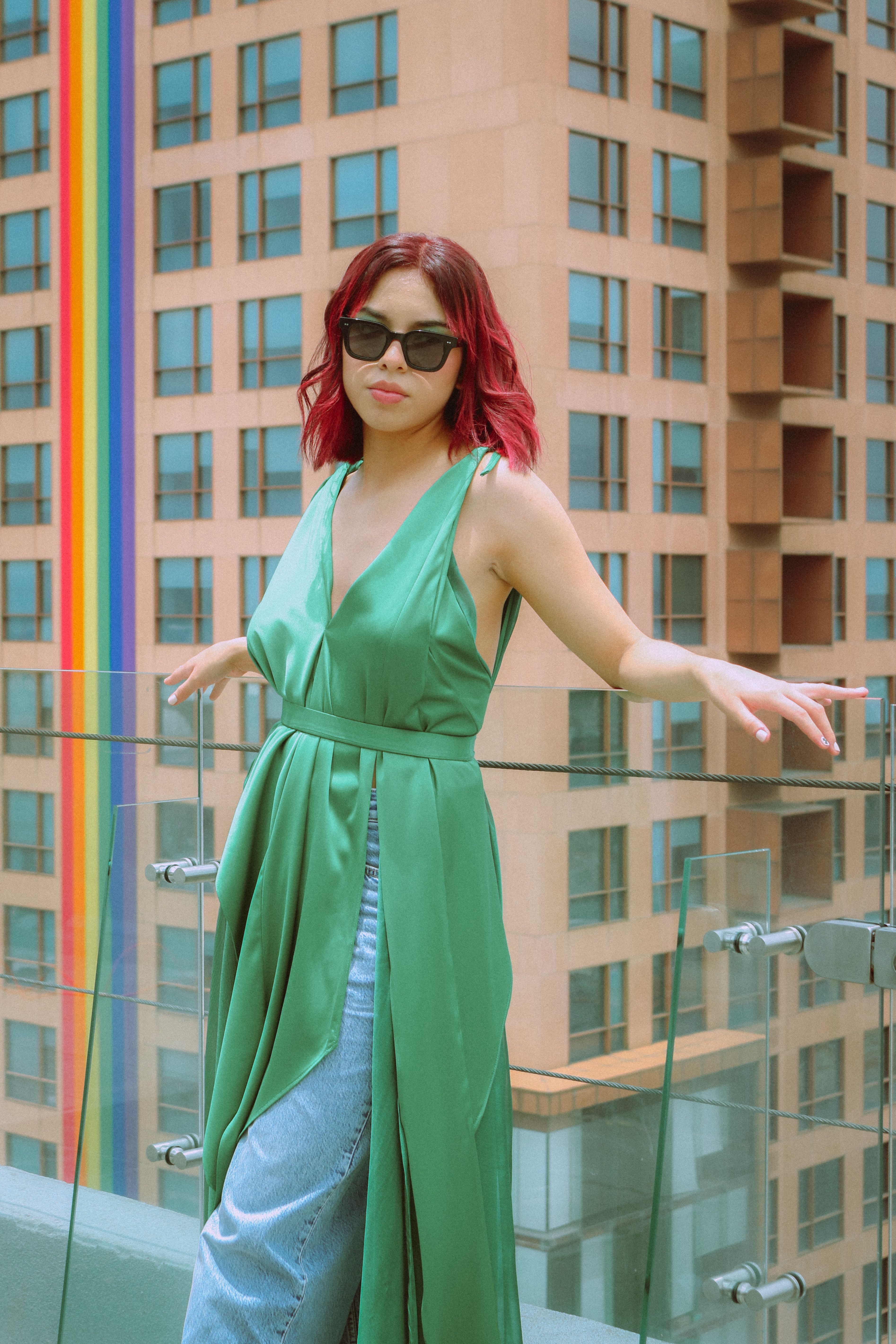 Woman in Greed Tunic and Jeans on Rooftop  Free Stock Photo