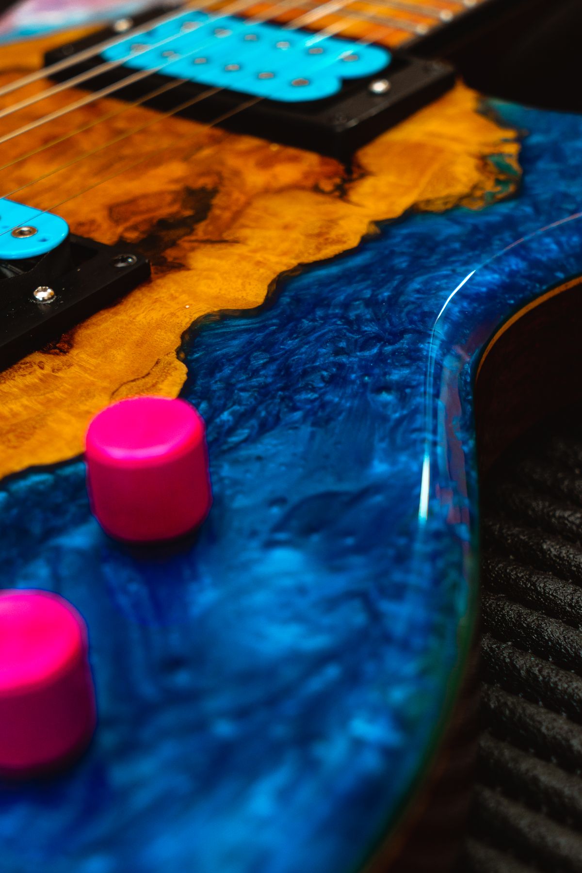 Electric guitar with a hand-painted blue swirl finish