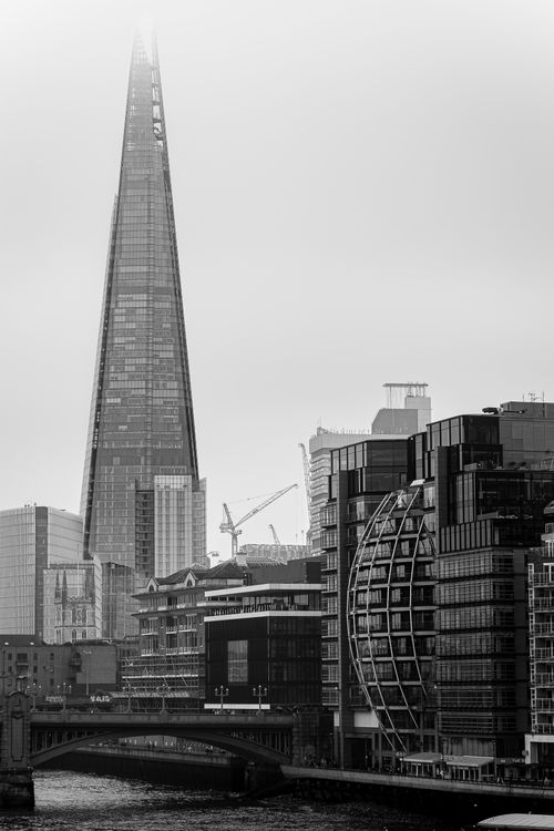 Free Monochrome view of London's urban skyline featuring The Shard and modern architecture. Stock Photo