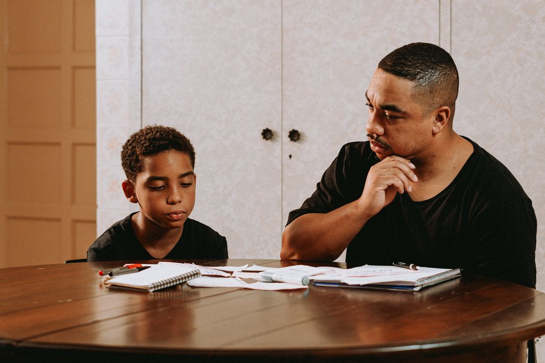 A father helping his son with homework