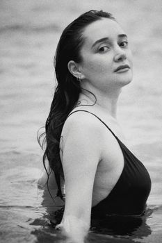 Stunning monochrome portrait of a woman in the sea at Antalya, Türkiye.