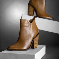 Brown leather ankle boots — photo by José Martin Segura Benites on Pexels