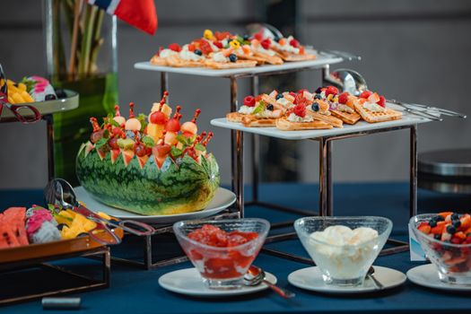 Colorful buffet with waffles and fruit in a Hanoi dining setting.