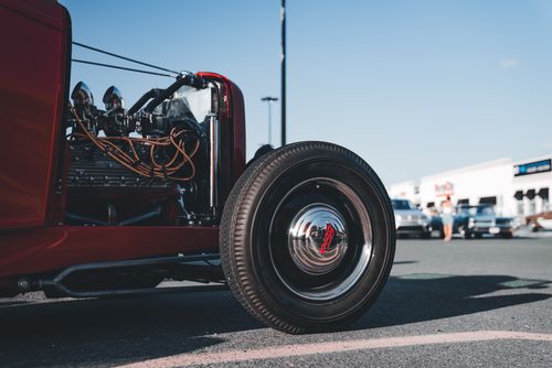 Free Close-up of a vintage hot rod wheel parked outdoors on a sunny day. Stock Photo