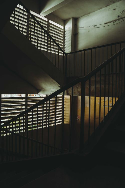 Free Moody staircase in Ho Chi Minh City with dramatic light and shadow play. Stock Photo
