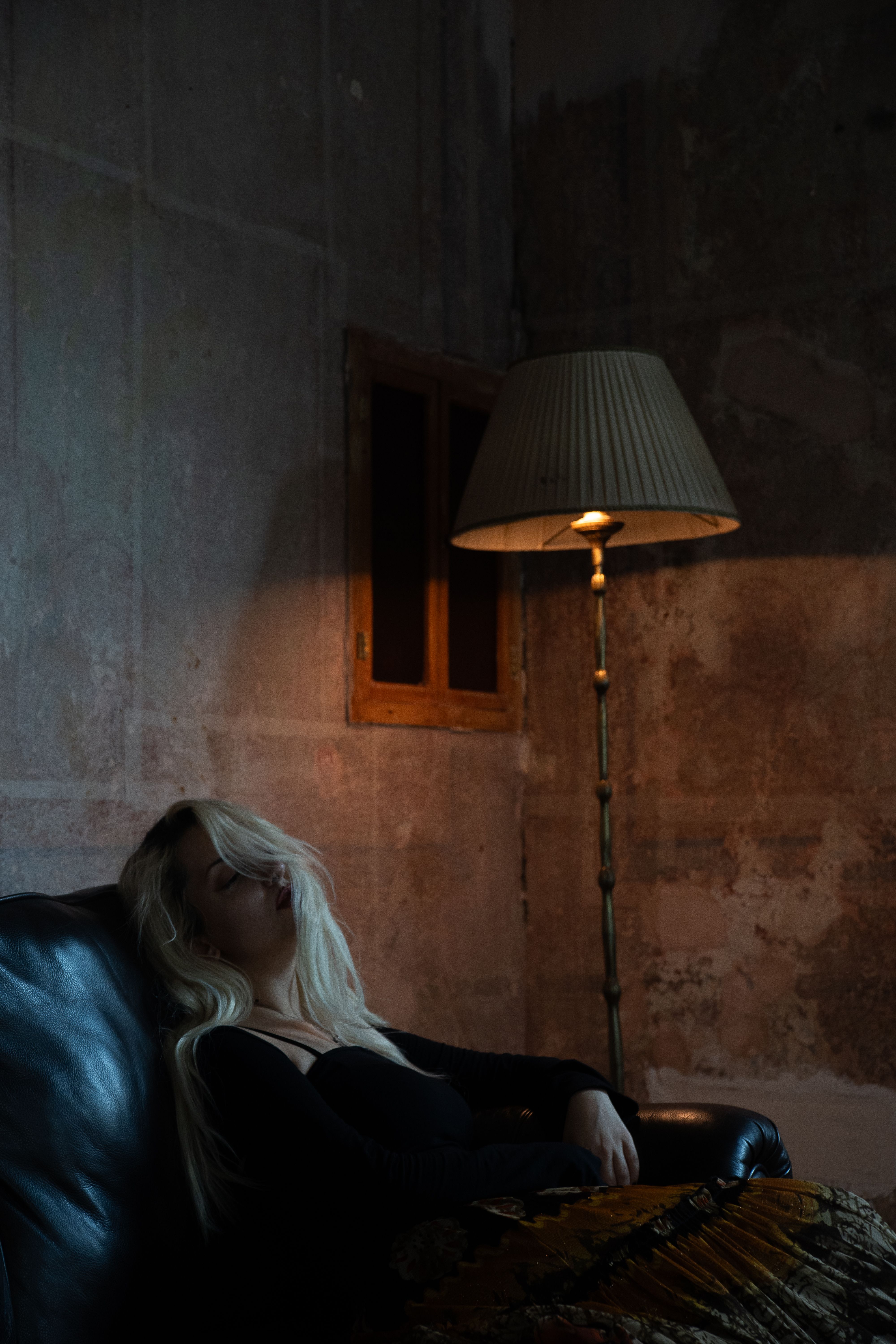 A Woman Sitting in a Dark Room · Free Stock Photo