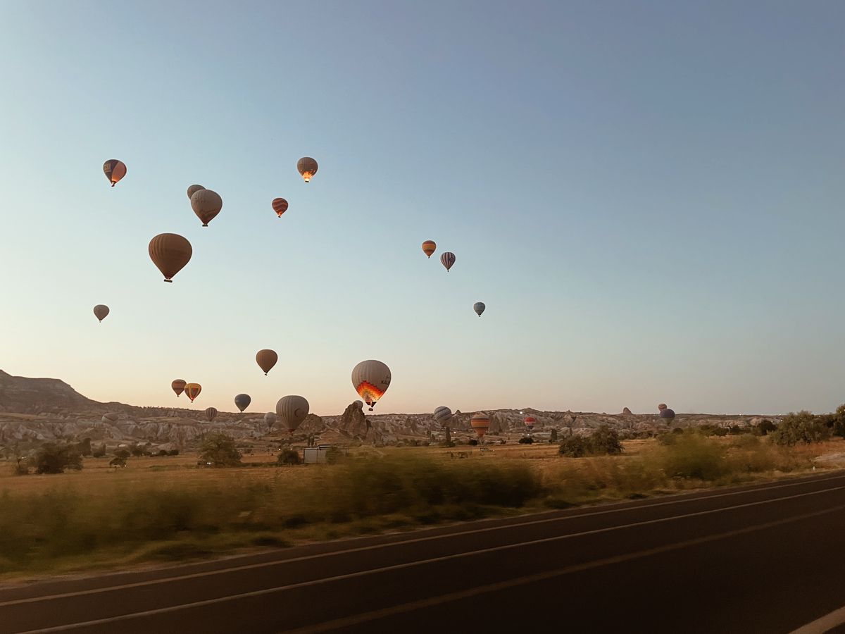 Hot air balloons over Cappadocia at dawn