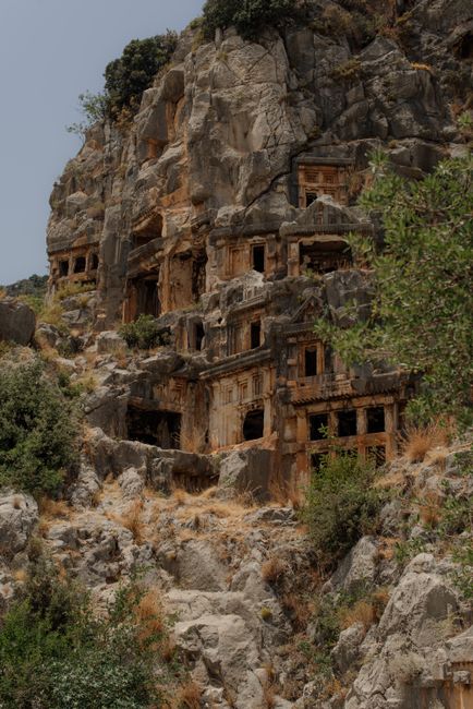 Explore the ancient rock tombs in Demre, Antalya, showcasing historic architecture in a dramatic landscape.