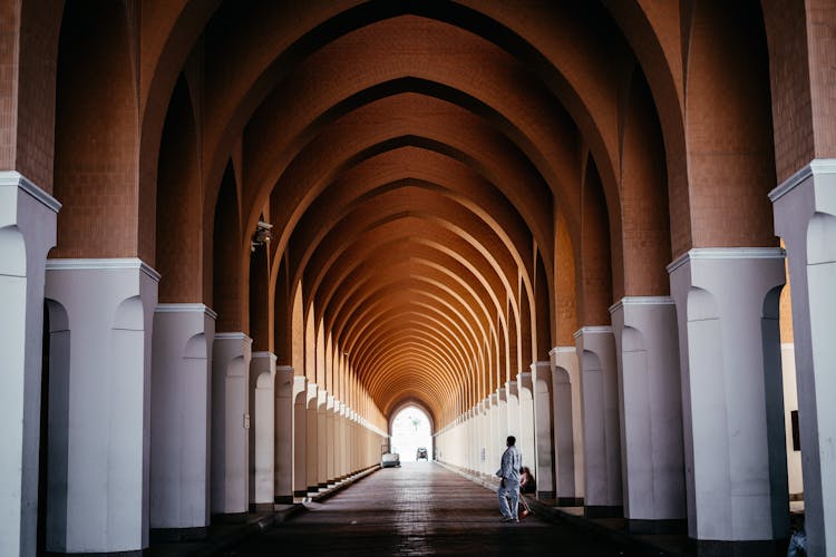 Man Standing Inside Temple